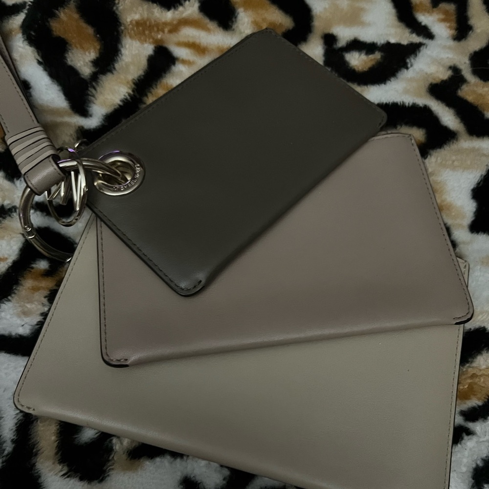 Michael Kors 3 piece wristlet new without tags a small medium and large wristlet